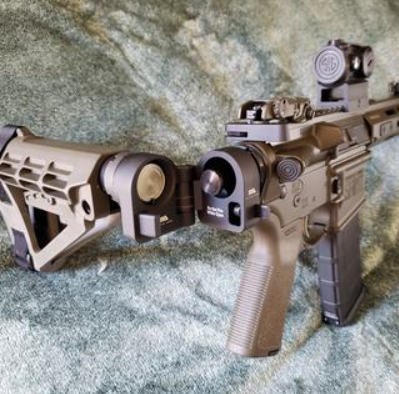 A Rifle With A Sylvan Arms Folding Stock Adapter